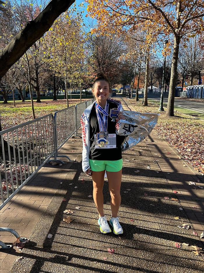 Manna Potter with her hardware at the 2023 Philadelphia Half Marathon